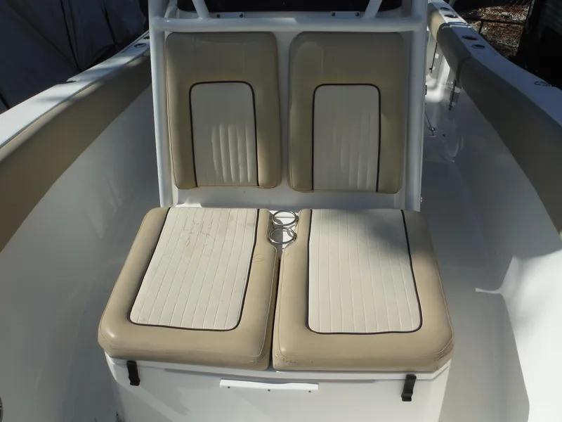 Slide: The Image of 2017 Sea Fox 266 Commander boat seating with beige cushions and cup holders. - 33