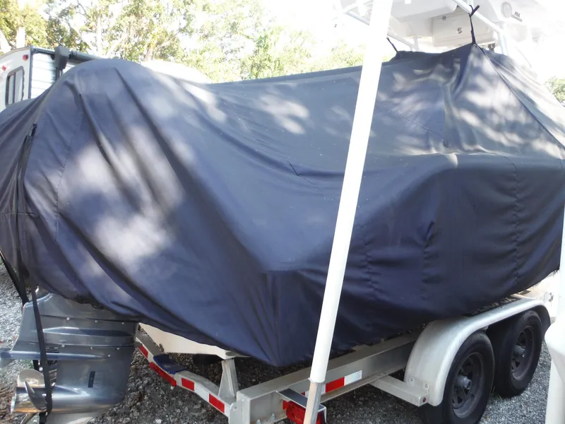 Slide: The Image of 2017 Sea Fox 266 Commander boat covered on a trailer, parked outdoors. - 5