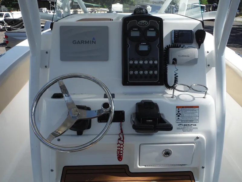 Slide: The Image of 2017 Sea Fox 266 Commander boat dashboard with Garmin navigation and control panel. - 8