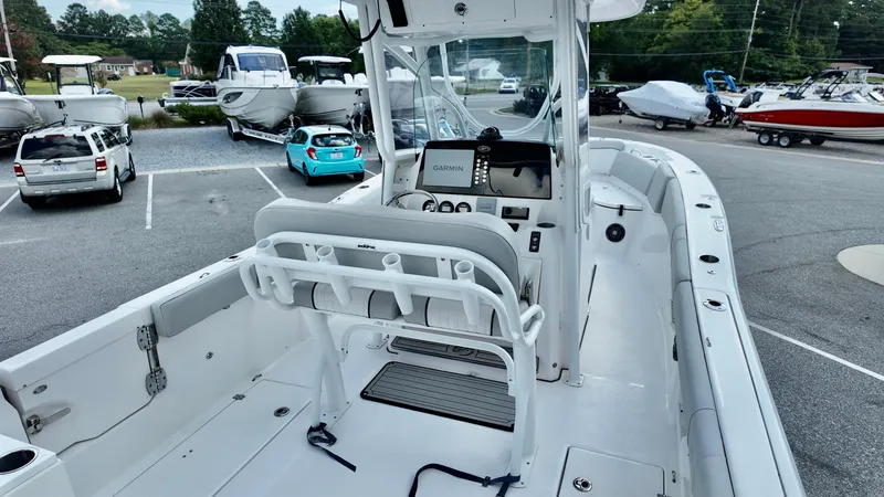 Slide: The Image of 2023 Sea Fox 268 Commander boat interior with Garmin navigation system, parked in a lot. - 11