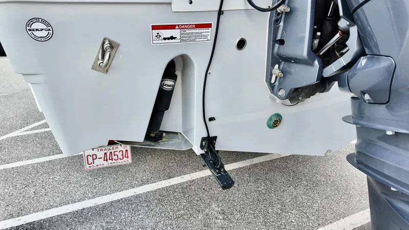 Slide: The Image of 2023 Sea Fox 268 Commander boat stern with motor and North Carolina trailer plate. - 14