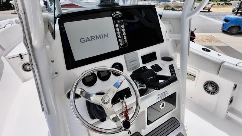 Slide: The Image of 2023 Sea Fox 268 Commander boat dashboard with Garmin navigation system and steering wheel. - 16