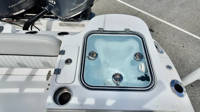 Slide: The Image of Livewell on 2023 Sea Fox 268 Commander boat, featuring dual outboard motors. - 18