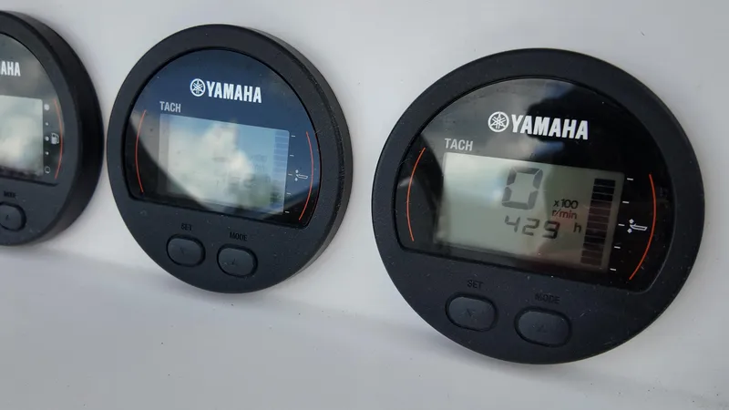 Slide: The Image of Yamaha tachometer on 2023 Sea Fox 268 Commander boat dashboard, displaying engine hours. - 19