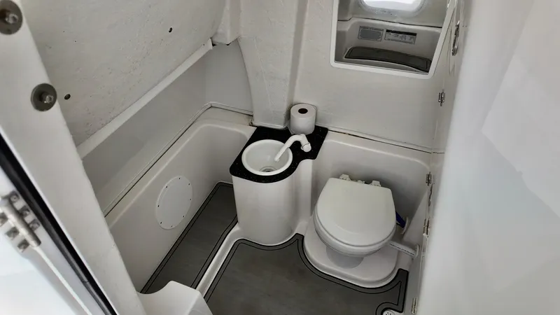 Slide: The Image of 2023 Sea Fox 268 Commander boat bathroom interior with toilet and sink. - 20