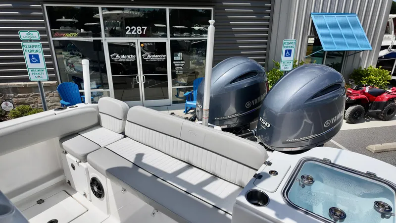 Slide: The Image of 2023 Sea Fox 268 Commander boat with Yamaha engines, parked outside dealership. - 21