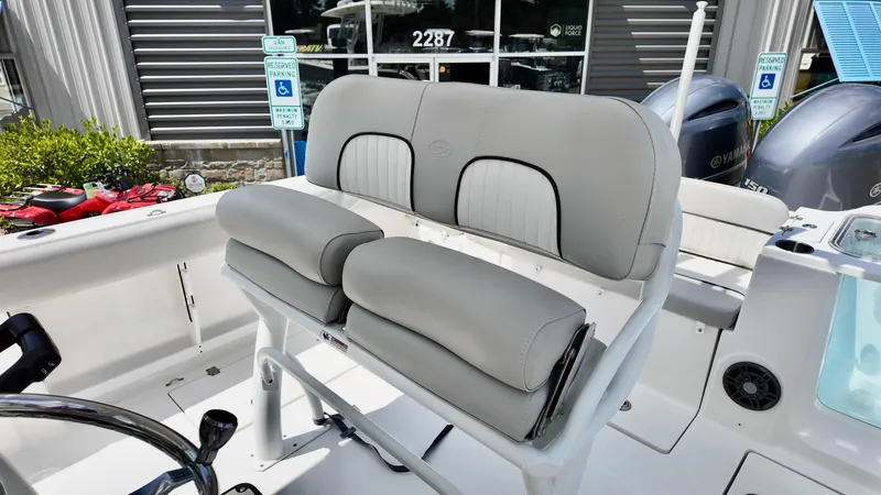 Slide: The Image of 2023 Sea Fox 268 Commander boat seating with dual Yamaha engines in the background. - 4