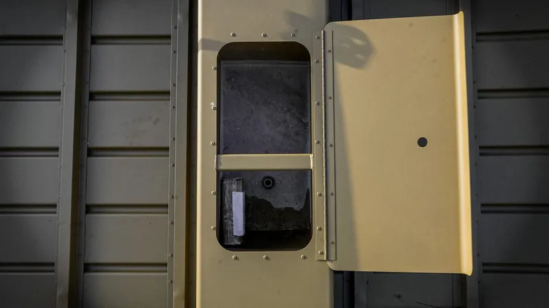 Slide: The Image of 2025 G3 Gator Tough 1648 LW boat with outboard motor and control handle. - 3