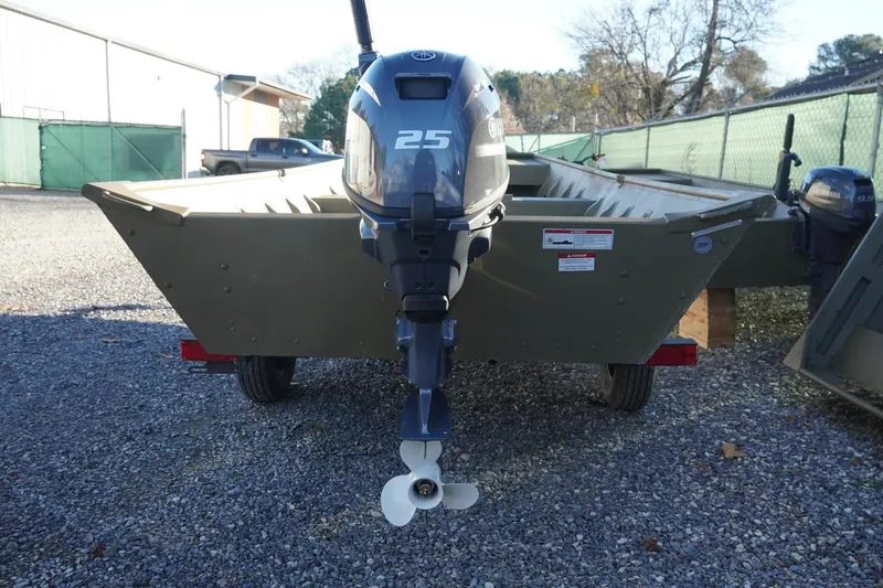 Slide: The Image of 2025 G3 Gator Tough 1648 LW boat with 25HP outboard motor, parked on gravel. - 7
