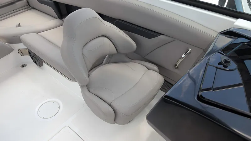 Slide: The Image of 2024 Four Winns HD8 OB boat interior with sleek gray seating and modern design. - 18