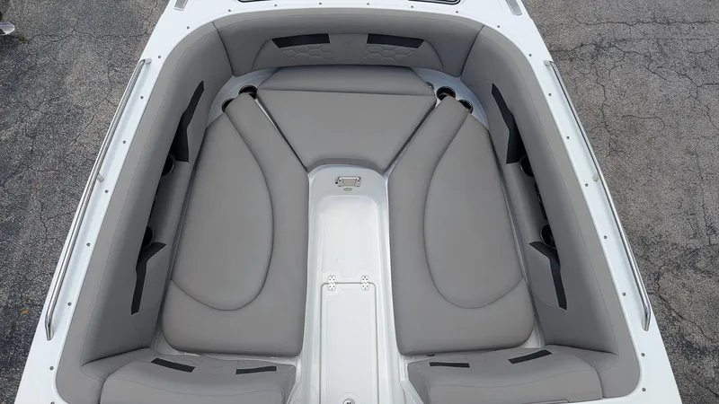 Slide: The Image of 2024 Four Winns HD8 OB boat interior with gray cushioned seating. - 21