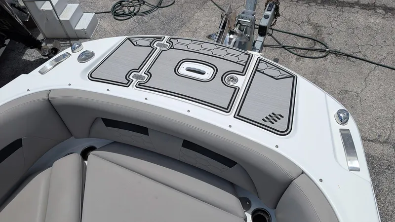 Slide: The Image of 2024 Four Winns HD8 OB boat with sleek seating and modern deck design. - 22