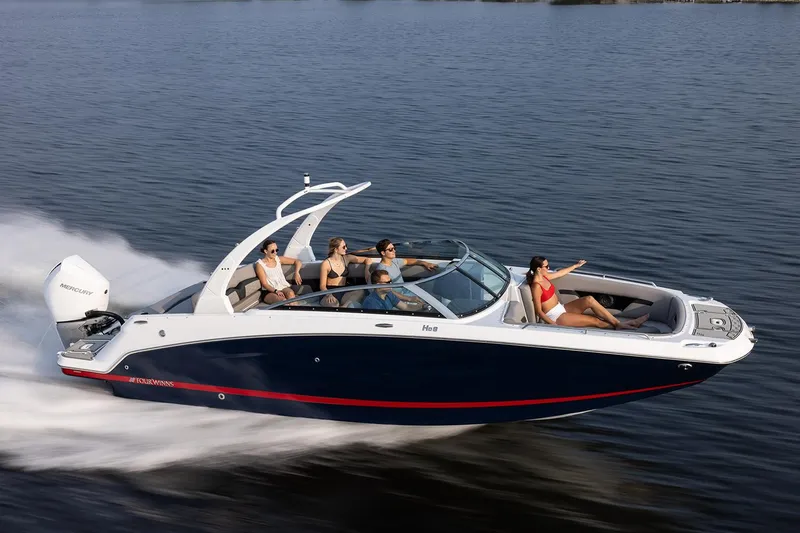 Slide: The Image of Manufacturer Provided Image: 2024 Four Winns HD8 OB speedboat cruising with passengers on a lake. - 25
