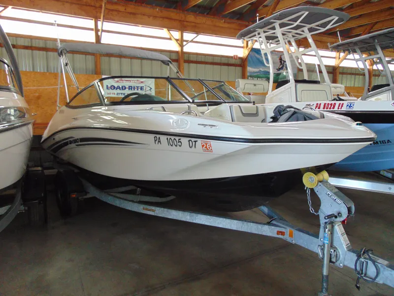 The Image of 2017 Yamaha Boats SX190 on trailer in indoor storage facility. - 1