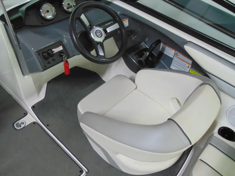 Slide: The Image of 2017 Yamaha Boats SX190 cockpit with steering wheel and comfortable seating. - 5