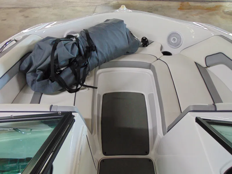 Slide: The Image of 2017 Yamaha Boats SX190 interior with seating and a rolled-up cover. - 7