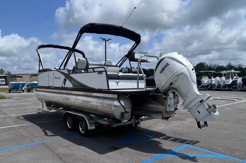 Slide: The Image of 2025 Tahoe LTZ VRB 23T DX pontoon boat with Yamaha outboard motor. - 6