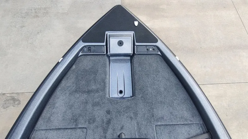 Slide: The Image of Bow of 2026 Phoenix 919 ZXL boat with carpeted deck and storage compartments. - 4