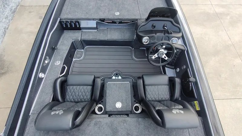 Slide: The Image of 2026 Phoenix 919 ZXL boat interior with dual seats and steering console. - 9