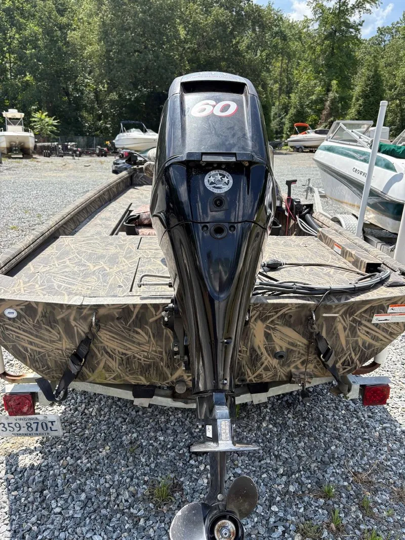 Slide: The Image of 2012 Crestliner 16 Ambush boat with camouflage design and 60 HP outboard motor. - 8