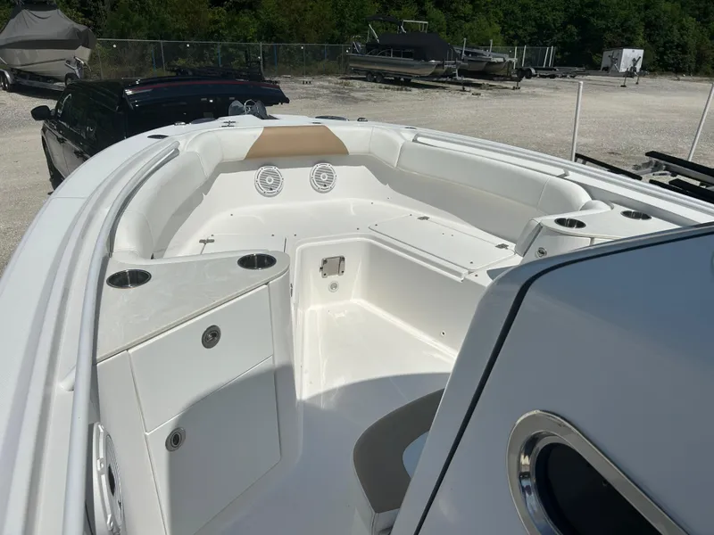 Slide: The Image of 2019 Edgewater 262CC boat interior with seating and storage compartments. - 10
