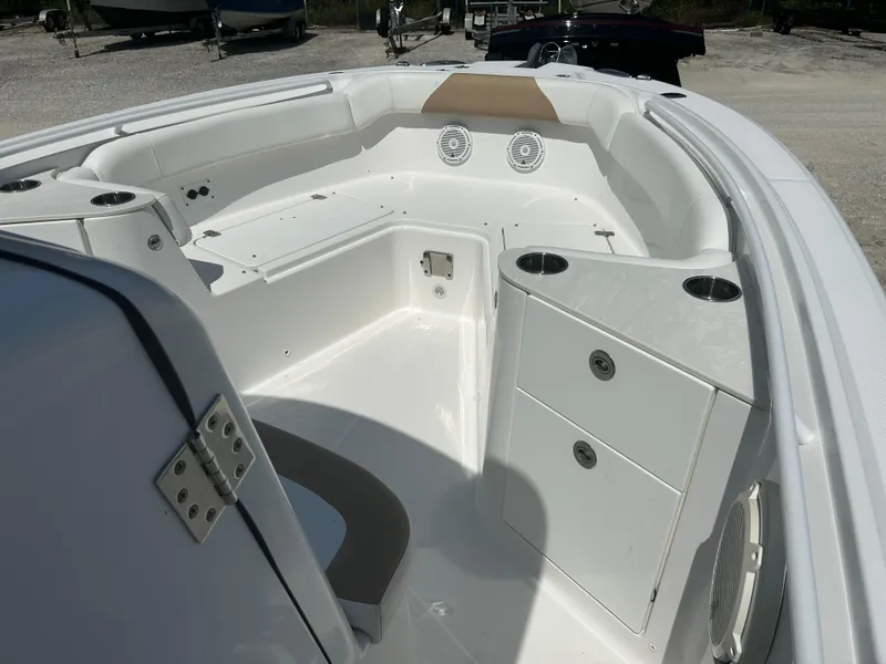 Slide: The Image of 2019 Edgewater 262CC boat interior with seating and storage compartments. - 16