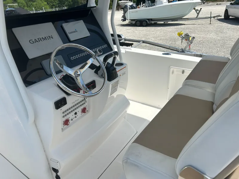 Slide: The Image of 2019 Edgewater 262CC boat cockpit with Garmin navigation system and dual seating. - 8