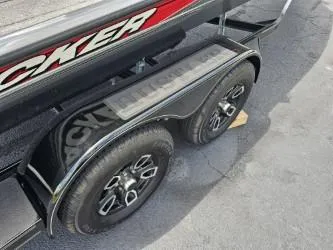Slide: The Image of 2016 Tracker Pro Team 190 TX trailer with dual wheels on pavement. - 13
