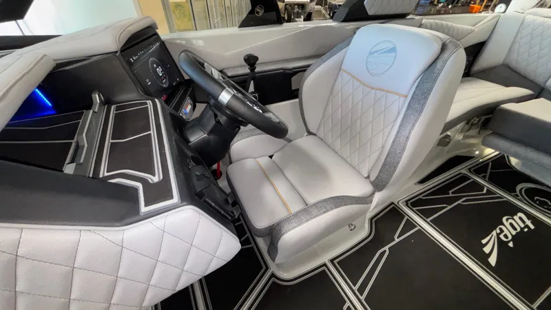 Slide: The Image of 2026 Tigé Z3 boat interior with modern dashboard and luxurious seating. - 18