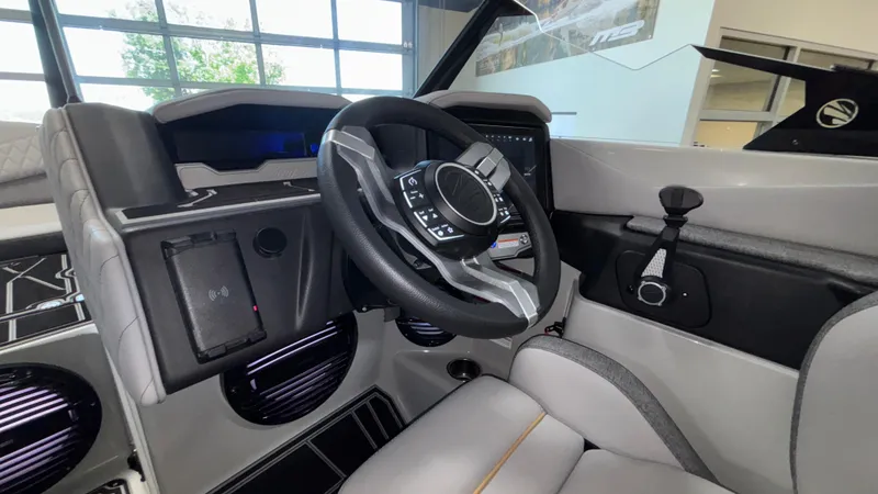 Slide: The Image of 2026 Tigé Z3 boat interior with modern steering wheel and dashboard controls. - 19