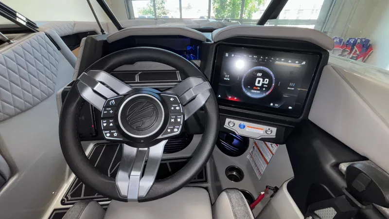 Slide: The Image of 2026 Tigé Z3 boat dashboard with modern steering wheel and digital display. - 20