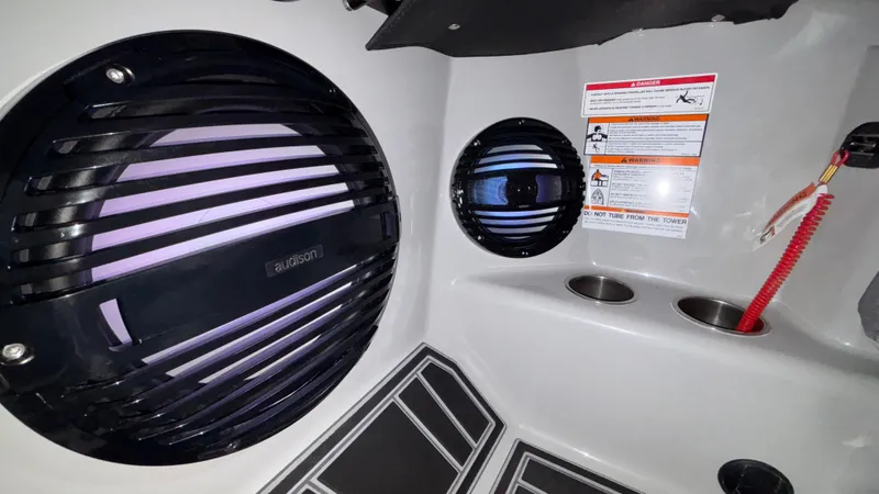 Slide: The Image of 2026 Tigé Z3 boat interior with Audison speakers and safety instructions. - 21