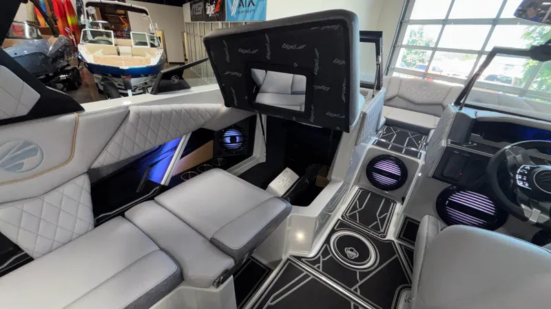 Slide: The Image of 2026 Tigé Z3 boat interior with modern seating, stylish flooring, and advanced dashboard features. - 24