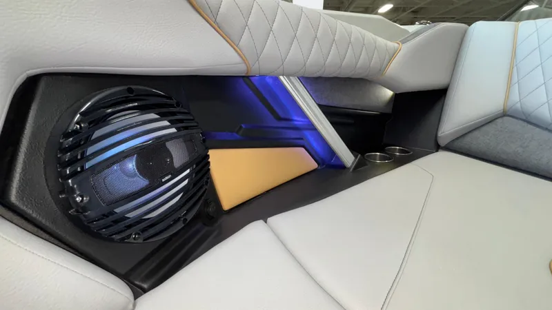 Slide: The Image of 2026 Tigé Z3 boat interior with speaker, cup holders, and stylish upholstery. - 32
