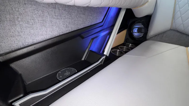 Slide: The Image of 2026 Tigé Z3 interior with cup holders, speaker, and ambient lighting. - 36