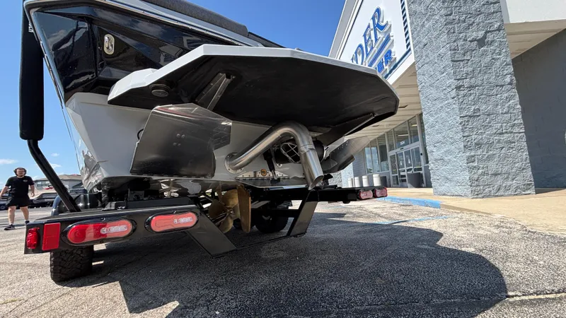 Slide: The Image of 2026 Tigé Z3 boat on trailer outside dealership, rear view. - 4
