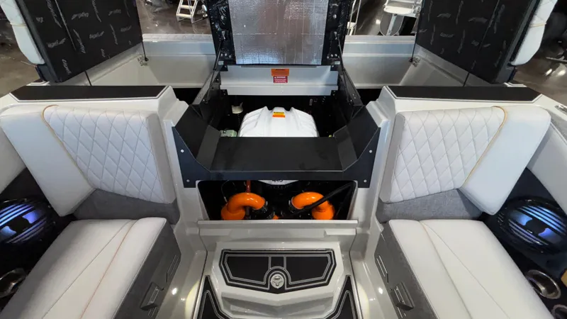 Slide: The Image of 2026 Tigé Z3 boat interior with engine compartment, featuring luxurious seating and modern design. - 41