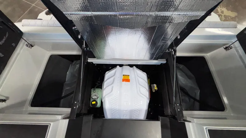 Slide: The Image of 2026 Tigé Z3 boat engine compartment with open hatch, showcasing internal components. - 44