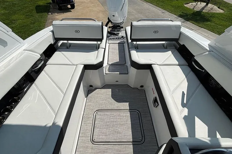 Slide: The Image of 2026 Cobalt R6 Outboard boat interior with white seating and modern design. - 10