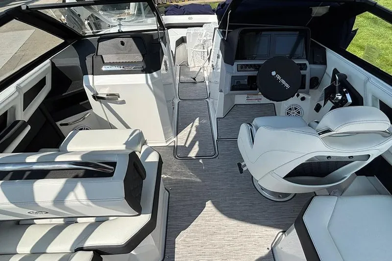 Slide: The Image of 2026 Cobalt R6 Outboard boat interior with modern seating and control panel. - 13