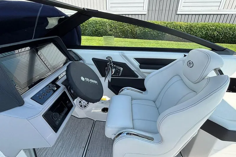 Slide: The Image of 2026 Cobalt R6 Outboard boat interior with modern dashboard and luxurious seating. - 16