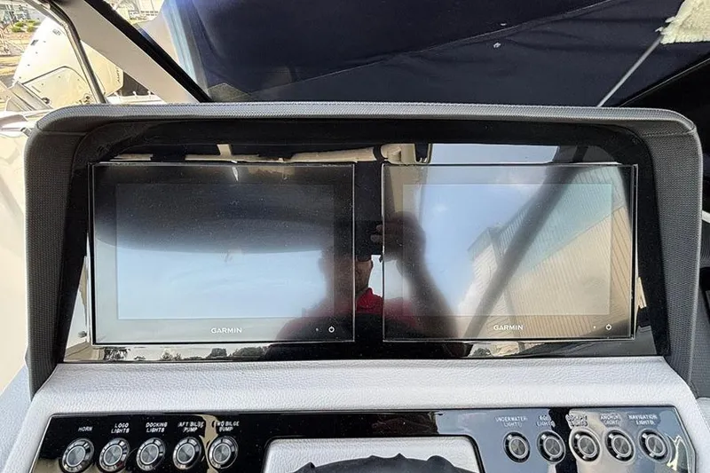 Slide: The Image of 2026 Cobalt R6 Outboard dashboard with dual Garmin displays and control panel. - 17