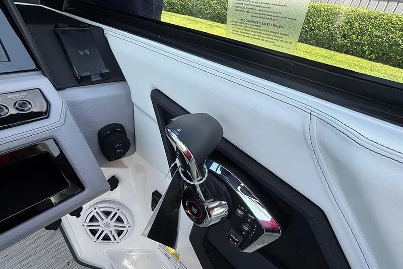 Slide: The Image of Interior of 2026 Cobalt R6 Outboard boat, featuring control panel and throttle lever. - 18