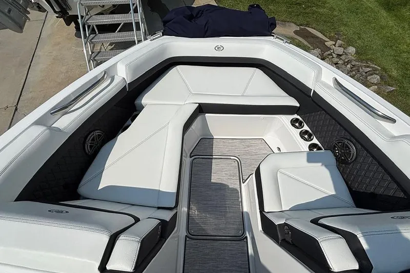 Slide: The Image of 2026 Cobalt R6 Outboard boat interior with white seating and modern design. - 19