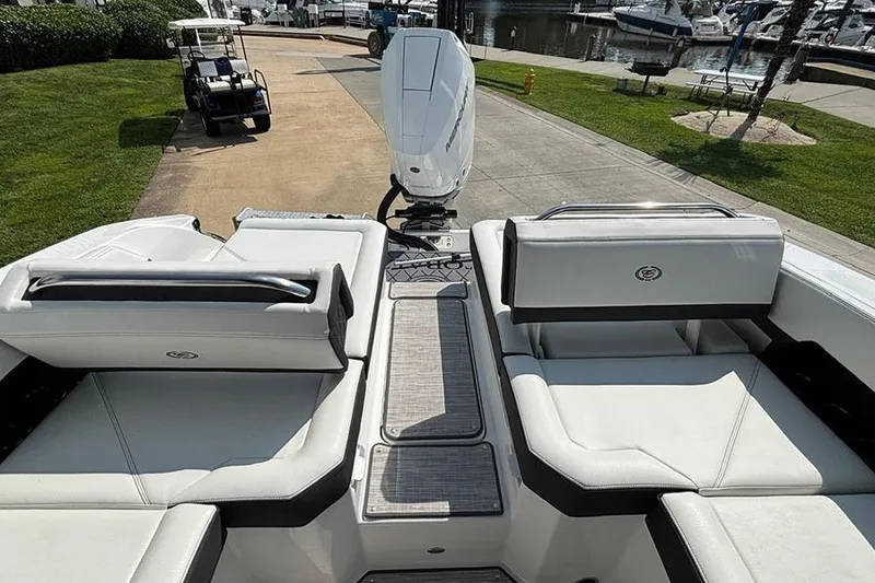 Slide: The Image of 2026 Cobalt R6 Outboard boat interior with white seating and outboard motor. - 8