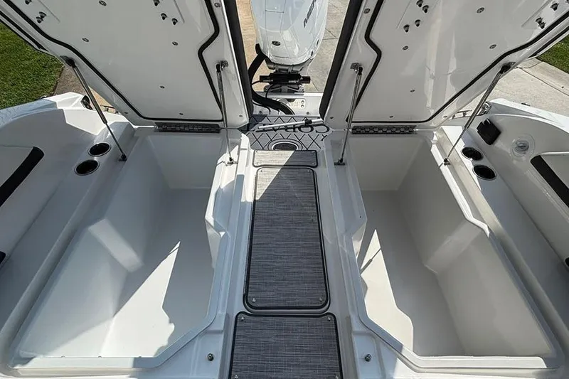 Slide: The Image of 2026 Cobalt R6 Outboard boat storage compartments open, showcasing spacious interior design. - 9