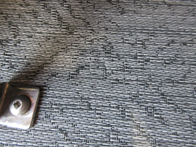 Slide: The Image of Close-up of textured surface with metal bracket, Sun Tracker SportFish 20 DLX 2026. - 10