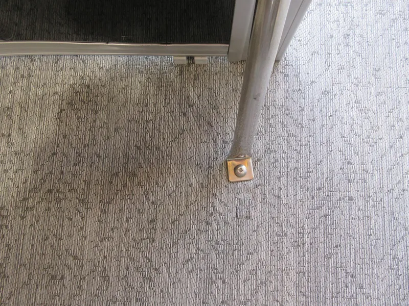 Slide: The Image of Carpeted floor and metal railing on 2026 Sun Tracker SportFish 20 DLX boat. - 11