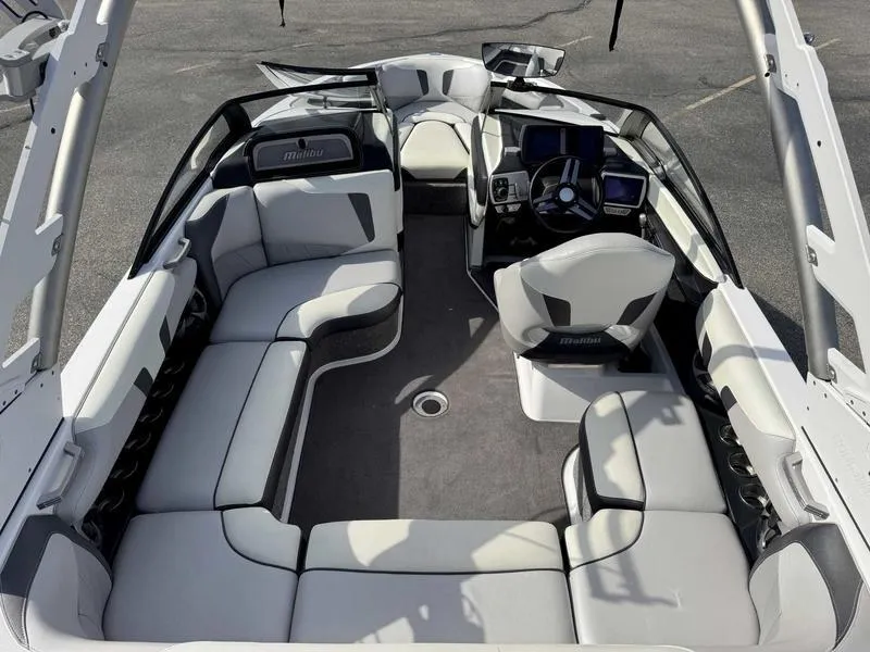 Slide: The Image of 2017 Malibu Wakesetter 20 VTX boat interior with plush seating and modern dashboard. - 10