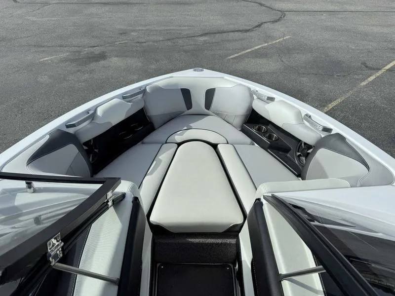 Slide: The Image of 2017 Malibu Wakesetter 20 VTX boat interior with cushioned seating and cup holders. - 11